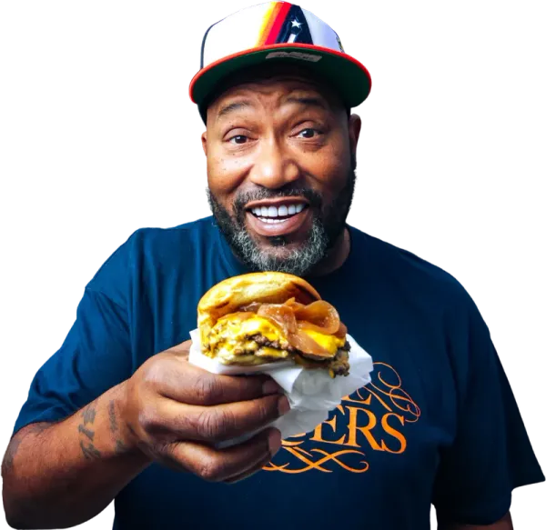 Bun B, co-founder, holding an OG Burger